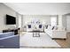 Bright and airy living room with stylish furniture, a large rug, and modern decor at 133 Cavalier Rider Run, Wendell, NC 27591