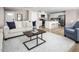 Open-concept living space with a living room, kitchen, and dining area at 133 Cavalier Rider Run, Wendell, NC 27591