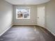 This bedroom features a neutral wall and window with a view of the home's exterior at 157 W Copenhaver Dr, Clayton, NC 27527