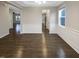 This dining room features hardwood floors, neutral paint, and decorative trim at 157 W Copenhaver Dr, Clayton, NC 27527