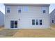 This home features a back patio, vinyl siding, and a grass backyard at 157 W Copenhaver Dr, Clayton, NC 27527
