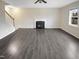 Spacious living room with hardwood floors, a fireplace, and large windows offering natural light at 157 W Copenhaver Dr, Clayton, NC 27527