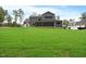 Spacious backyard with a screened porch and fireplace, perfect for outdoor entertaining at 1600 Sweetwater Ln, Raleigh, NC 27610