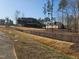 An expansive backyard with a large home and wooded perimeter at 1600 Sweetwater Ln, Raleigh, NC 27610