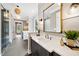 Elegant bathroom with a marble countertop, modern fixtures, and glass enclosed shower at 1600 Sweetwater Ln, Raleigh, NC 27610