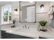 Modern bathroom vanity featuring a white countertop, stylish fixtures, and decorative accents at 1600 Sweetwater Ln, Raleigh, NC 27610