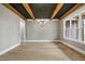 Spacious dining room features wood beams and ample natural light at 1600 Sweetwater Ln, Raleigh, NC 27610