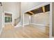 Bright open-concept dining room featuring hardwood floors and a modern chandelier at 1600 Sweetwater Ln, Raleigh, NC 27610