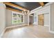 Open dining room showcases hardwood floors, coffered ceiling, and a large window at 1600 Sweetwater Ln, Raleigh, NC 27610