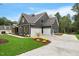 Beautiful home with a three car garage and lush landscaping at 1600 Sweetwater Ln, Raleigh, NC 27610