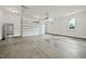 Spacious garage with concrete flooring and a large garage door at 1600 Sweetwater Ln, Raleigh, NC 27610