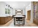Modern kitchen with an island, pendant lighting, stainless steel appliances and custom cabinets at 1600 Sweetwater Ln, Raleigh, NC 27610