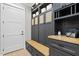 This mudroom has built-in cabinets and a bench to make coming and going easier and more organized at 1600 Sweetwater Ln, Raleigh, NC 27610