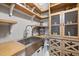 This custom pantry features a farmhouse sink, wood countertops and shelves and a beverage refrigerator at 1600 Sweetwater Ln, Raleigh, NC 27610
