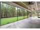 Spacious screened porch with ceiling fans and a beautiful view of the backyard at 1600 Sweetwater Ln, Raleigh, NC 27610