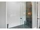 Modern shower featuring white subway tile, a sleek glass enclosure, and a built in bench at 1600 Sweetwater Ln, Raleigh, NC 27610