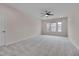 Expansive primary bedroom featuring neutral walls, carpeted floors, and large windows at 1680 Mint River Dr, Apex, NC 27502