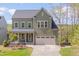 Attractive two-story home featuring a two-car garage and well-maintained landscaping at 1680 Mint River Dr, Apex, NC 27502