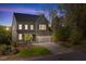 Charming two-story home featuring an attached two-car garage and beautifully landscaped front yard at 1680 Mint River Dr, Apex, NC 27502