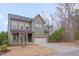 Charming two-story home with an attached garage and beautifully landscaped front yard at 1680 Mint River Dr, Apex, NC 27502