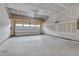 Unfinished garage with high ceilings and an open garage door at 1680 Mint River Dr, Apex, NC 27502
