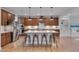 Gourmet kitchen boasts a large island, stainless steel appliances, and ample cabinet space at 1680 Mint River Dr, Apex, NC 27502