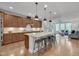 Gourmet kitchen boasts a large island, stainless steel appliances, and ample cabinet space at 1680 Mint River Dr, Apex, NC 27502