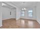 Bright living room featuring hardwood floors and a view of the entryway at 1680 Mint River Dr, Apex, NC 27502