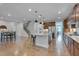 Open-concept living area features hardwood floors and seamless flow to the kitchen and dining at 1680 Mint River Dr, Apex, NC 27502