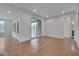 Spacious living room with hardwood floors and sliding doors to the screened porch at 1680 Mint River Dr, Apex, NC 27502