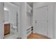 Mud room and half bath featuring wainscoting, tile flooring, and built-in storage at 1680 Mint River Dr, Apex, NC 27502