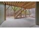 Covered outdoor patio with wooden staircase and a view of wooded backyard at 1680 Mint River Dr, Apex, NC 27502