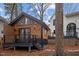 Modern backyard cabin featuring wood siding, a black-trimmed deck, and lots of natural light at 202 Oxford Hills Dr, Chapel Hill, NC 27514