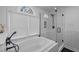 Bright bathroom features a modern tub and shower with white subway tile surround at 202 Oxford Hills Dr, Chapel Hill, NC 27514
