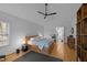Bright bedroom with a modern bed frame and sleek fan creates a serene atmosphere at 202 Oxford Hills Dr, Chapel Hill, NC 27514