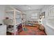 Charming room with a custom loft bed, cozy reading nook, and a neutral color palette at 202 Oxford Hills Dr, Chapel Hill, NC 27514