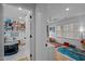 Brightly lit playroom with large windows and built-in shelving in a neutral color palette at 202 Oxford Hills Dr, Chapel Hill, NC 27514