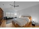 Bright bedroom with a modern bed frame and sleek fan creates a serene atmosphere at 202 Oxford Hills Dr, Chapel Hill, NC 27514