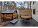 Spacious wooden deck with a dining table and chairs, perfect for outdoor entertaining at 202 Oxford Hills Dr, Chapel Hill, NC 27514