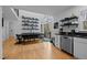 An open dining area features sleek table, open shelving with books, and access to the patio at 202 Oxford Hills Dr, Chapel Hill, NC 27514