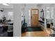 Welcoming foyer with hardwood floors, a decorative mirror, and easy access to the living areas at 202 Oxford Hills Dr, Chapel Hill, NC 27514
