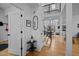 Inviting foyer with open floor plan and a view into the modern dining area at 202 Oxford Hills Dr, Chapel Hill, NC 27514