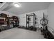 Organized garage with exercise equipment and storage shelves is perfect for fitness enthusiasts at 202 Oxford Hills Dr, Chapel Hill, NC 27514