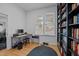 Bright home office with built-in bookshelves, desk, and a window providing natural light at 202 Oxford Hills Dr, Chapel Hill, NC 27514