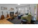 Cozy living room with a fireplace, guitars, and comfortable seating for relaxing or entertaining guests at 202 Oxford Hills Dr, Chapel Hill, NC 27514
