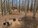 Backyard play area with a wooden playset, slide, and outdoor seating at 202 Oxford Hills Dr, Chapel Hill, NC 27514