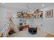 Brightly lit playroom with large windows, teepee, and open shelving in a neutral color palette at 202 Oxford Hills Dr, Chapel Hill, NC 27514