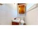This bathroom has a sink, toilet, medicine cabinet, and a window for natural light at 2118 Timberlake Dr, Raleigh, NC 27604