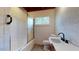 Bathroom with a shower/tub, vanity sink, toilet, and a window providing natural light at 2118 Timberlake Dr, Raleigh, NC 27604