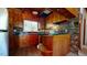 Cozy kitchen with wood cabinets, breakfast bar, and laminate countertops at 2118 Timberlake Dr, Raleigh, NC 27604